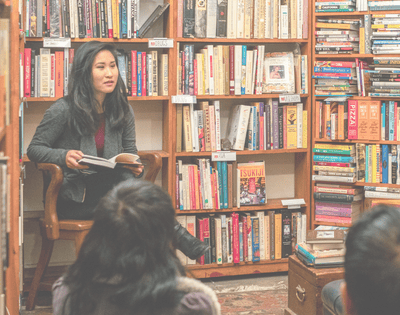Teacher in library with students